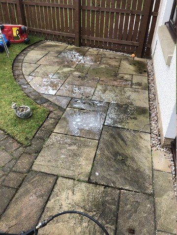 Before — Pressure Washing — patio and walkway stone stripped of algae and stains.